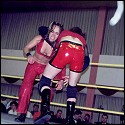 No mercy being shown by her male opponent here! Simply Luscious is set up for a suplex...