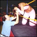 Some weaselly manager takes advantage of Brandi from the outside and chokes her hard on the middle rope. Where's the ref? Being distracted by Babydoll!