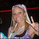 Daizee Haze flashes a smile and peace sign at the SHIMMER show.