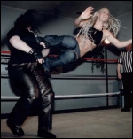 An Angel Williams dropkick is about to put Elmira The Iron Madien down to the mat.