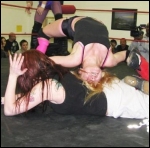 Ashley uses a nice bridge to urge a submission out of her opponent.