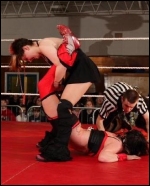 Faith utilizes a boston crab to try to get the submission.