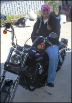 Fantasia likes to spend time away from the ring on her Harley.