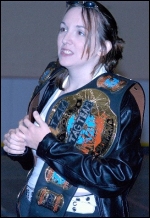 Laura Phoenix protects the belts as her men battle in the ring. (Photo: John McEvers) Laura Phoenix protects the belts as her men battle in the ring. (Photo: John McEvers)