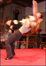 Sara often takes on male opponents. Here she is nailing one poor guy with a hard-hitting suplex.