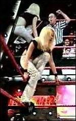 Talia climbs the ring ropes during her televised match against Victoria on WWE Heat.