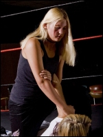 Kassie works the arm and shoulder of her opponent.