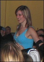 Skye makes her way through the crowd towards the ring.